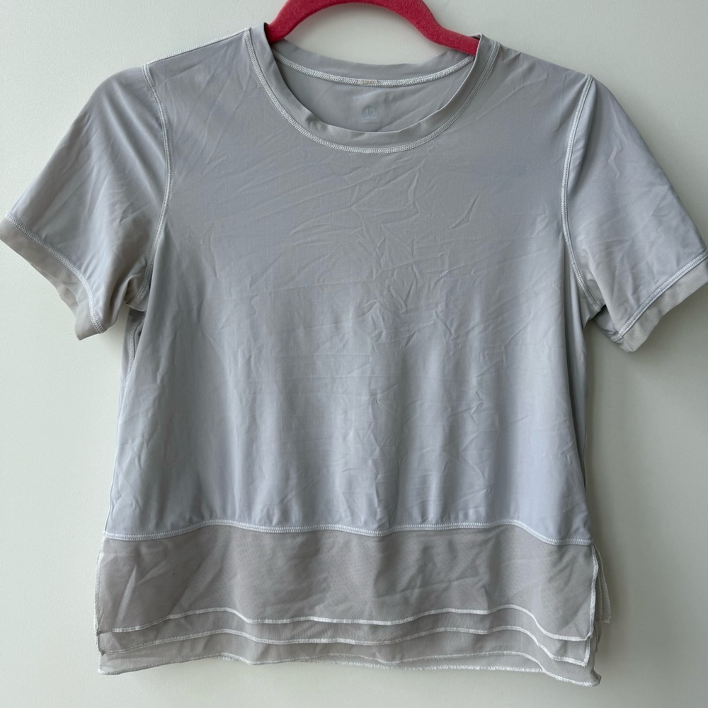 Lululemon grey short sleeve with layered mesh bottom detail